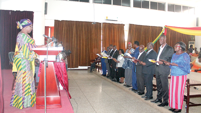 Hajia Alima Mahama (left), Minister of Local Government and Rural Development, swearing in the members of the Institute of Local Government Council. Picture: MAXWELL OCLOO