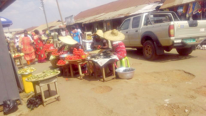 Brisk trading right on the street behind the Central Market in Sunyani