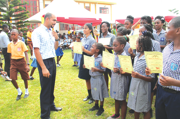 Mr Samir Kalmoni, congratulating pupils  and  students of the Soul Clinic International School, Accra, for  excelling in their exams.