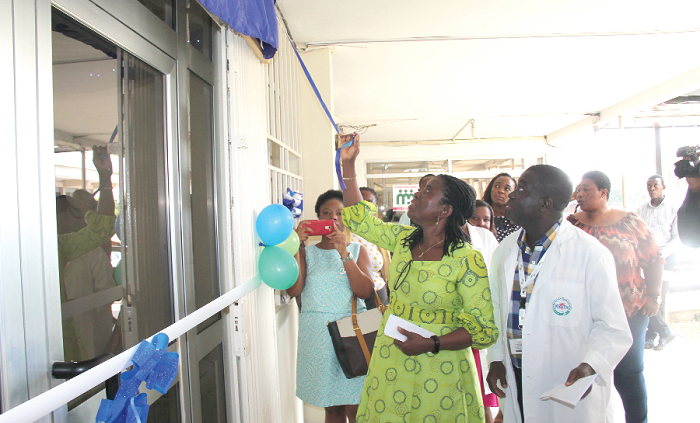 Dr Samuel Asiamah (right), Director of Medical Affairs, KBTH, and Mrs Elizabeth Bruce (2nd right) unveilling the signage of the refurbished centre at the KBTH. INSET: The refurbished Pharmacy Department Counseling Centre. Picture: EDNA ADU-SERWAA