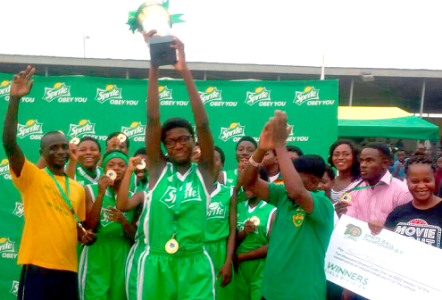 Captain of Wesley Girls’ SHS team, Miss Dorothy Kodua holds aloft the trophy the school won