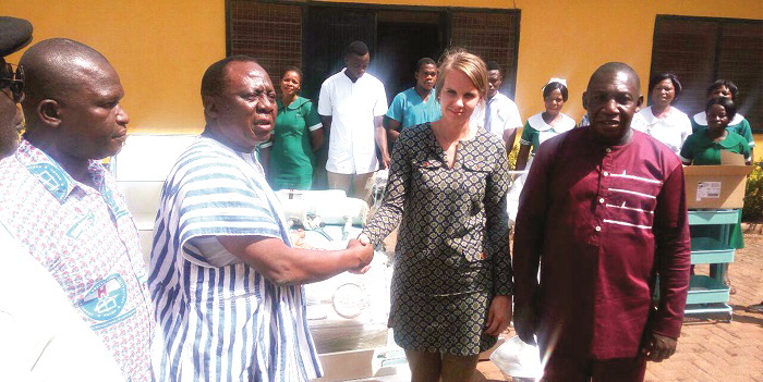 Ms Helena Hoek (right) in a handshake with Mr Imoro Mahama during the handover ceremony. With them are Dr Mahamadu Mbiniwaya  (2nd right) and Mr Jeremiah Tiimob (2nd left), the Administrator of the Central Hospital.