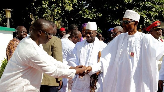 Mr Barrow (L) and Mr Jammeh (C) held talks with Nigerian President Buhari (R) last week