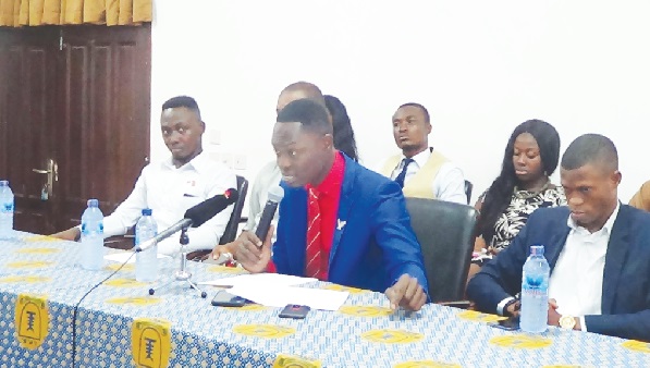 Mr Sidney Quartey (middle), SRC President  of UPSA, addressing the media at the press conference. With him are Messrs Maxwell Kofi Buaka (2nd left) and Wisdom Gmayan (right), GUPS President. Picture: OWUSU INNOCENT.