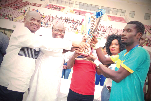  Wa All Star captain, Kweku Asuandzie receives the supercup from right George Amoako PLB vice chairman, Kweku Eyiah (GFA EmCo member) and GFA acting General Secretary, Isaac Addo (partly covered) s