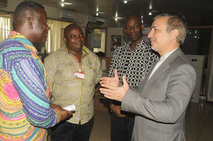  Dr Nosratollah Maleki (right), the Ambassador of Islamic Republic of Iran, interacting with Mr Nehemiah Owusu Achiaw (left), the News Editor of the Daily Graphic, during a visit to the newsroom in Accra. Those with them are Mr Ransford Tetteh, Editor of the Daily Graphic, and Mr Aswad Ibrahim Basha (2nd right), Administrative Manager at the Embassy of Iran.