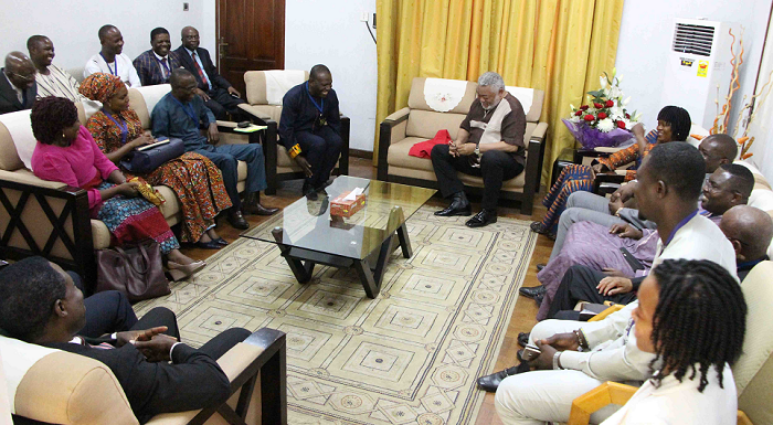  Former President  John Rawlings (middle) and the MPs at his office