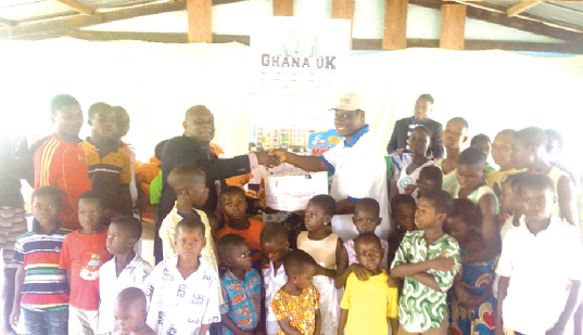 Mr Ato Hanson (left) presenting the items to Rev. Victor Ofori-Amoah