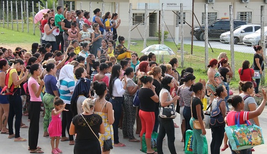 Relatives of inmates gathered at the main gate of the prison asking for information