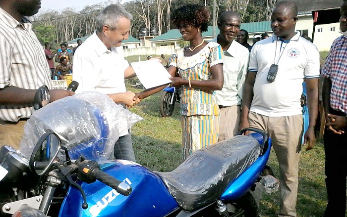 Mr Barre (second left) presenting the best worker award to Madam Cobbinah