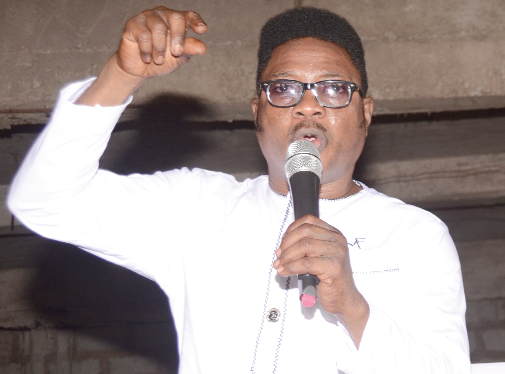 Rev. Maxwell K.K. Liwangol delivering the sermon