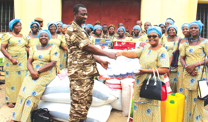 Mrs Helen Kwami presenting the items on behalf of the association to Superintendent Wilson Sallah of the Ghana Prisons Service