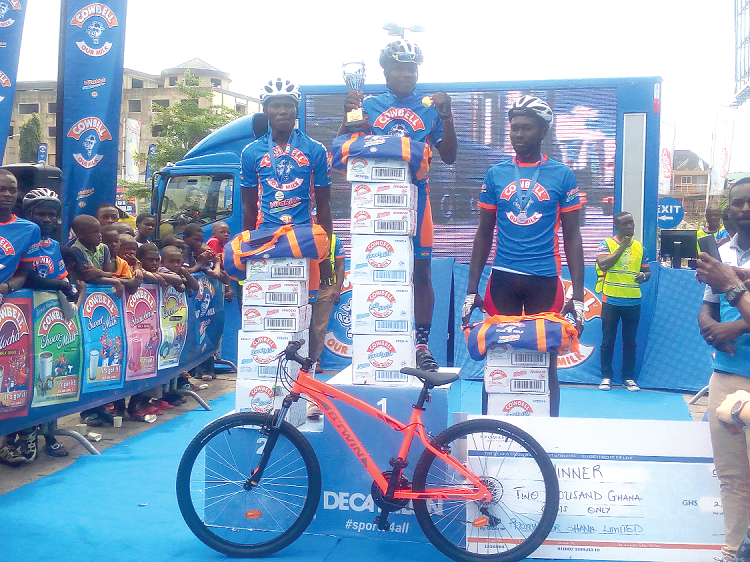 Frank Akuffo (middle) shows off his trophy and medal as second-placed Isaac Sackey and third-placed Emmanuel Sackey look on