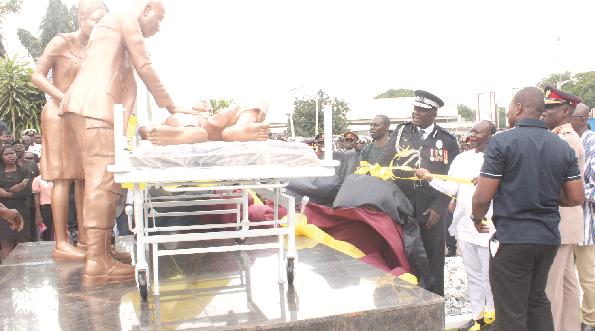 Mr Ken Ofori-Atta (2nd left), the minister of Finance,  unveiling a monument in commemoration of the 75th anniversary of the 37 Military Hospital. Looking on are  Lt Gen Obed Akwa (partly covered), the Chief of Defence Staff, and Mr David Asante Appeatu (left), the Inspector General of Police.   Picture: NII MARTEY M. BOTCHWAY