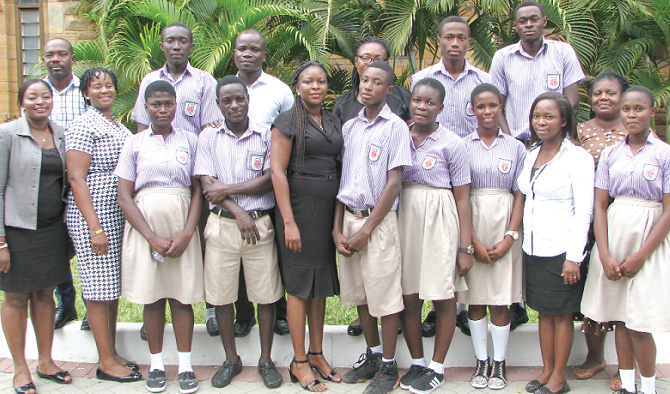 Mrs Jacqueline Avotri (5th left) with some officials of the Economic and Organised Crime Office and students of the Holy Trinity Cathedral Senior High School