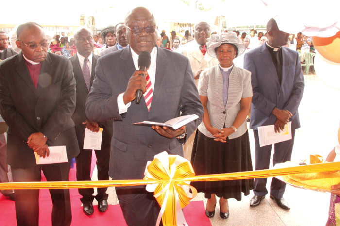 • Rev. Dr Douglas Okunah Frempong (with mic), the General Overseer, Christian Outreach Ministry, dedicating the Suame circuit  of the House of Faith Ministries. Flanking him are the General Overseer of the church, Rev. Alfred Nyamekye (left), and Wife, Rev. Mrs Esther Nyamekye