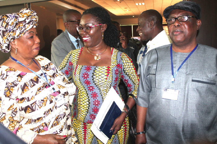 • Ms Martine Conde (left), Chair, High Authority of Communication, Republic of Guinea, explaining a point to Mrs Ursula Owusu-Ekuful (2nd left) and Nana Kwasi Gyan-Apenteng (right) after the opening session of the  forum