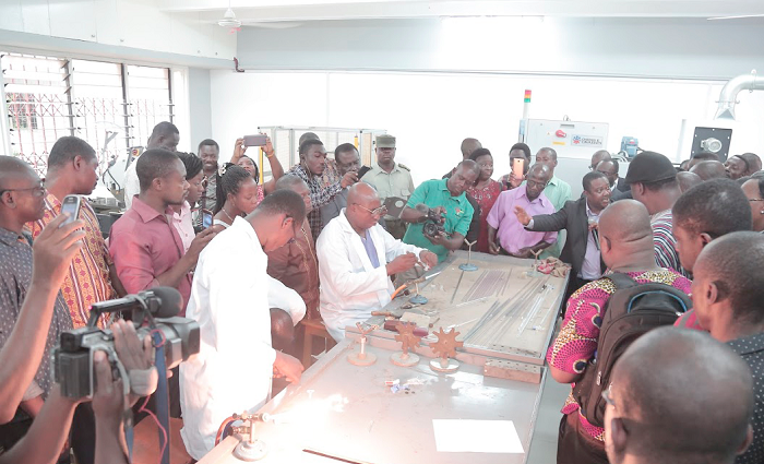 • Mr Gabriel Amo Mensah, a glass blower, demonstrating how test tubes are made
