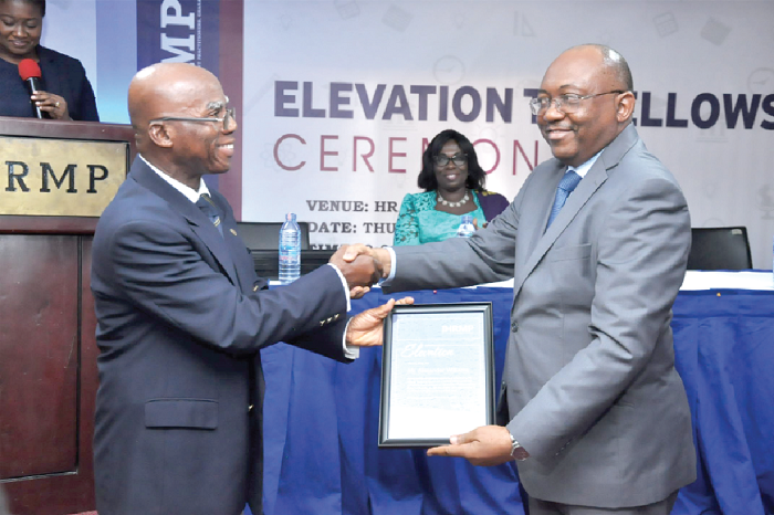 • Mr Alexander Williams (right) receiving a citation from Mr John Mbroh