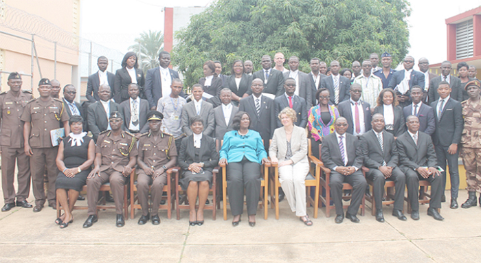 (SEATED) Mrs Theodora Georgina Wood (middle), Mrs Yvonne Attakorah Obuobisa (4th left), Director of Public Prosecutions, Attorney-General, Ms Margit Thomsen (4th right), the Danish Ambassador to Ghana, and other officials with participants in the programme held at the Nsawam Prison