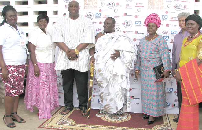 Mr  Henry Quartey (3rd left), Deputy Minister of the  Interior, in a group photograph with Mrs Abigail Padi (left), President of the Newtown Printers' Association and some members of the association