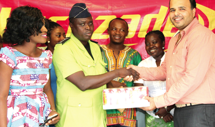 Mr Thakkar (right) presenting the items to Mr Lamptey while officials from Rafimex and the GABF look on