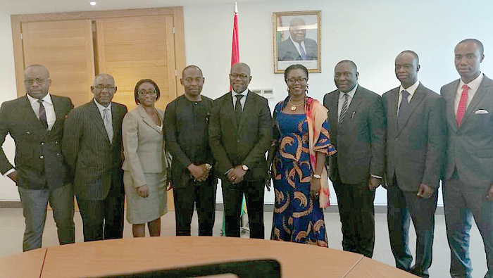 Mrs Ursula Owusu-Ekuful (4th right), Kweku Sakyi-Addo (middle) and other members of the board