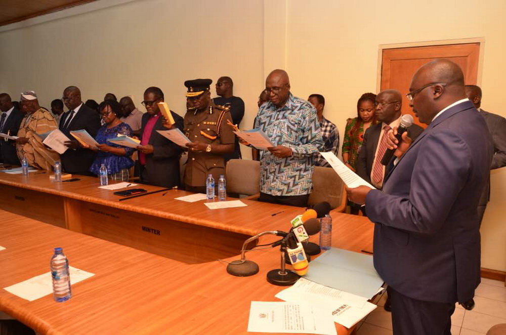 Vice-President Dr Mahamudu Bawumia (right) swearing in members of the Prisons Service Council in Accra