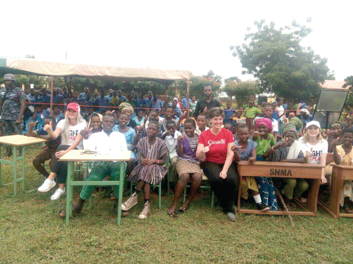 Mrs Bibeau (middle)  with the school’s drama  group. On her left and right are the two Right To Play Ambassadors, Ms Kaylyn Kyle and Ms Joannie Rochette