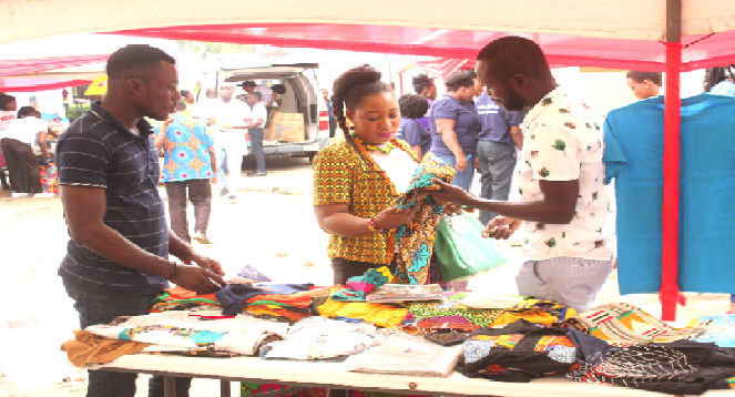 A guest purchasing a product from one of the exhibition stands. Picture: NII MARTEY M. BOTCHWAY