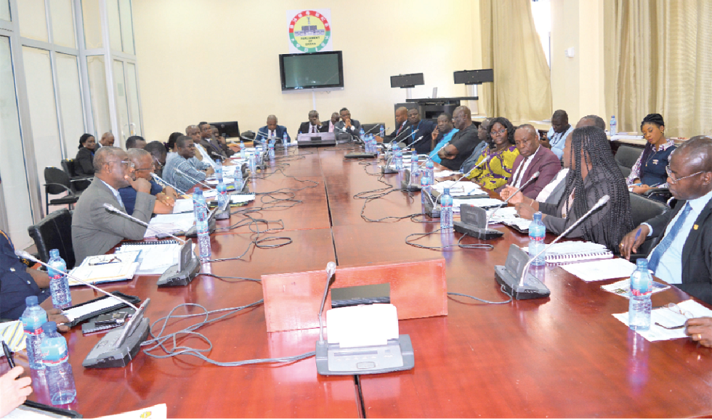 Mr Titus-Glover (middle), the Chairman of the committee, with Mr Fifi Kwetey (right), the Ranking Member of the committee, listening to the presentations by the stakeholders during the meeting. Picture: DELLA RUSSEL OCLOO