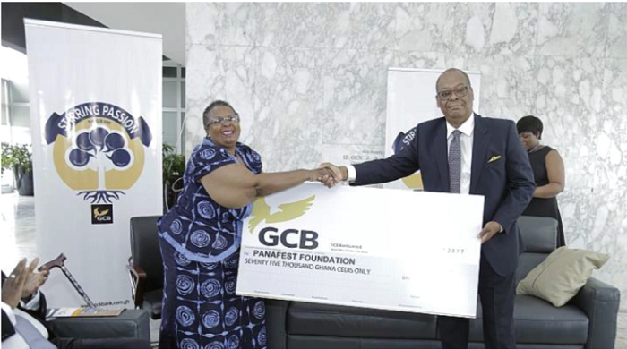 • Mr Anselm Ray Sowah (right), MD of GCB Bank, presenting the cheque to Prof. Esi Sutherland-Addy