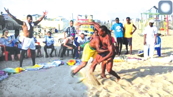 Two wrestlers tango at one of the competitions organised by GAWA
