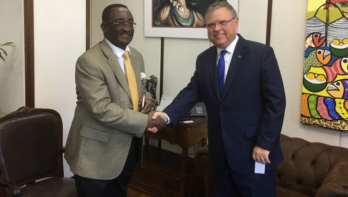 Dr Owusu Afriyie Akoto in a handshake with Mr Blairo Maggi (right)