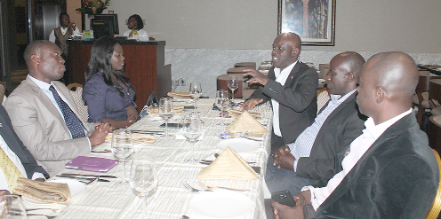 Mr Osei-Owusu (arrowed) in a discussion with some members of the association