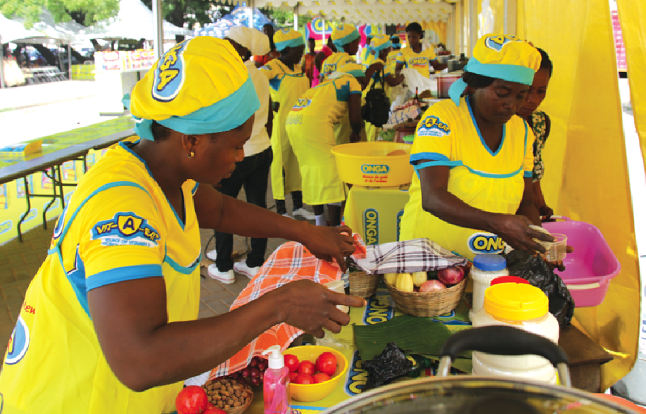 Some of the contestants busy cooking their dishes