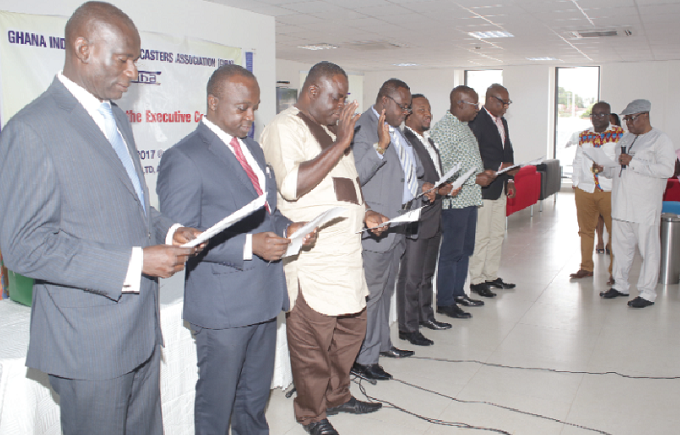 The new executive council being sworn into office by the NMC Chairman, Nana Gyan Appenteng (right)