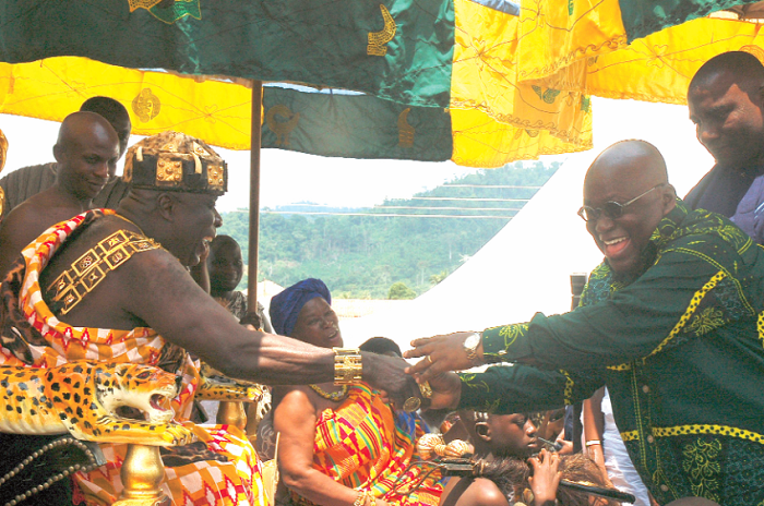 Okyenhene Osagyefuo Amoatia Ofori Panin thanking Nana Addo Dankwa Akufo Addo for presenting him firewood during the Ohum Festival