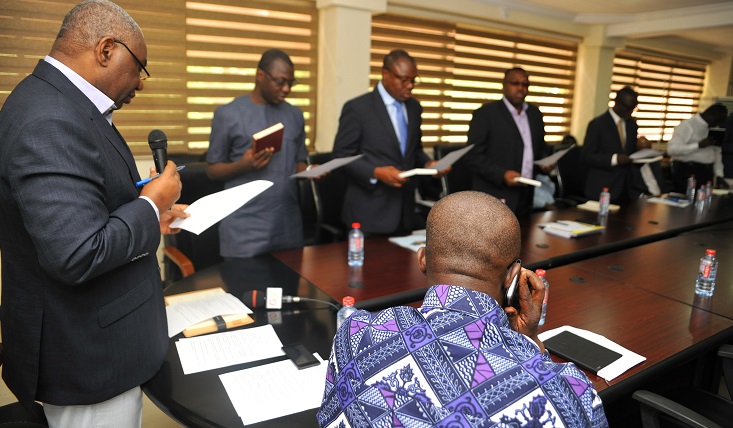 Mr Boakye Agyarko (left), the Minister of Energy, swearing in the committee at the Conference Room of the Ministry of Energy in Accra