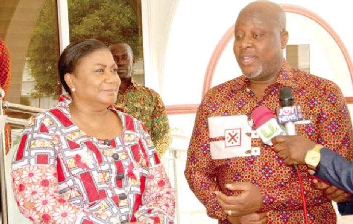 Mr Kwame Sefa Kayi (right) addressing the First Lady