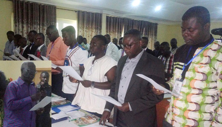 Osafo Marfo (insert) swearing the committee members
