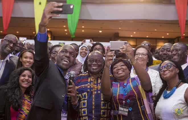 President Akufo-Addo poses for a selfie with participants