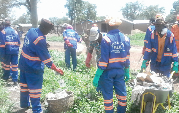 Some Zoomlion staff who joined the residents in a clean-up exercise
