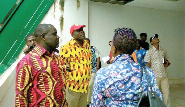 Mr Kwaku Ofori Asiamah, Minister of transport (left), his deputy, Mr Titus Glover, and the CEO of GSA, Ms Benonita Bismarck (back to camera) inspecting the leaky roof