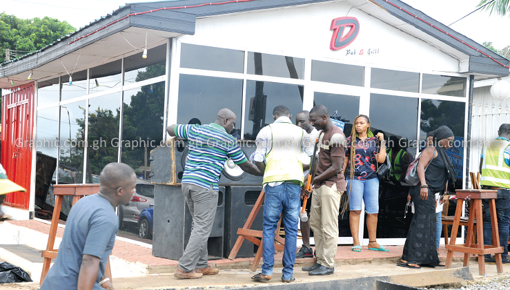 Madam Shatta Michy pleading with officials of the AMA not to demolish her structure