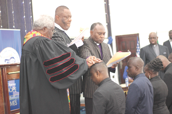 Rt Rev Prof. Emmanuel Martey (left), immediate  past Moderator of the Presbyterian Church of Ghana, together with Rev Dr Isaac Quaye (middle), Founder and Generel Overseer, Word of Life Christian Centre, and Rev Alfred Myamekye (right), praying for the ordained pastors. Picture: NII MARTEY M. BOTCHWAY