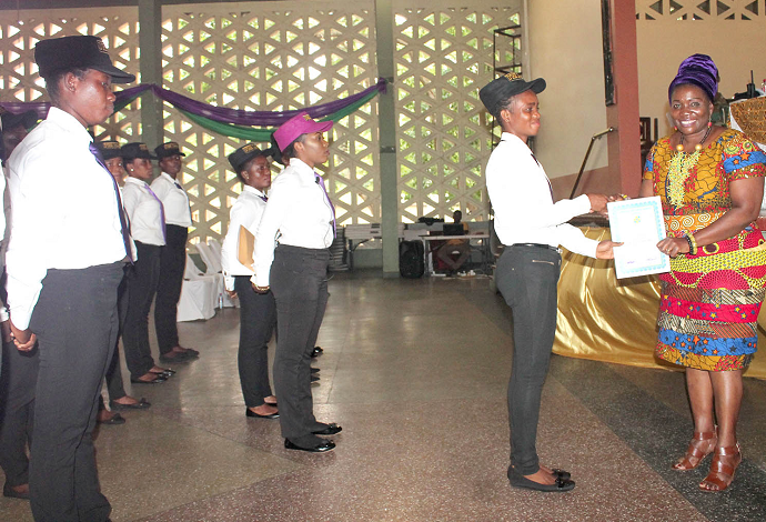 Mrs Mawusi Nudekor Awity (right), Executive Director of NVTI, presenting a certificate to Ms Mary Laloko Agboli, a graduate