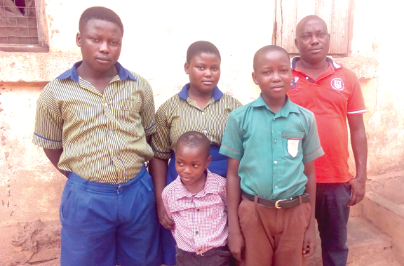 Mr Otu(right), the widower, with his four children. Below: The deceased, Cynthia Nuwersu 