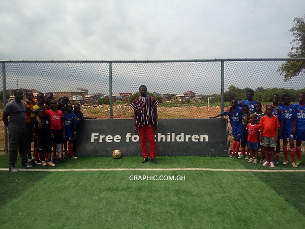 Mr Lamptey with the youngsters of Prince FC at the East La Sports Complex on Saturday