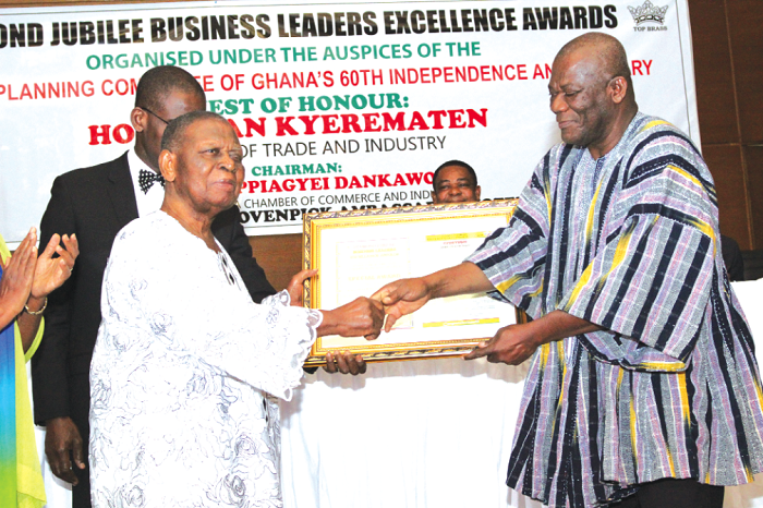  Mr Dawarnoba Baeka (right), presenting a Diamond Jubilee Award in the Financial Services category to Mr John Sackah Addo, Chairman, Prudential Bank Limited